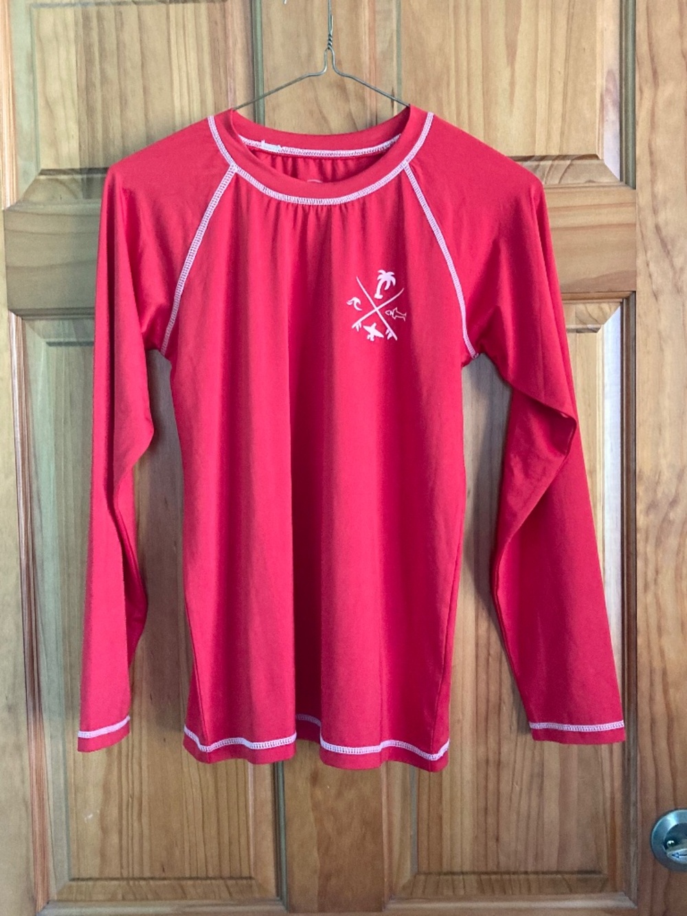 Boy’s size 12/14 Quad Seven long sleeved red swim shirt/rash guard